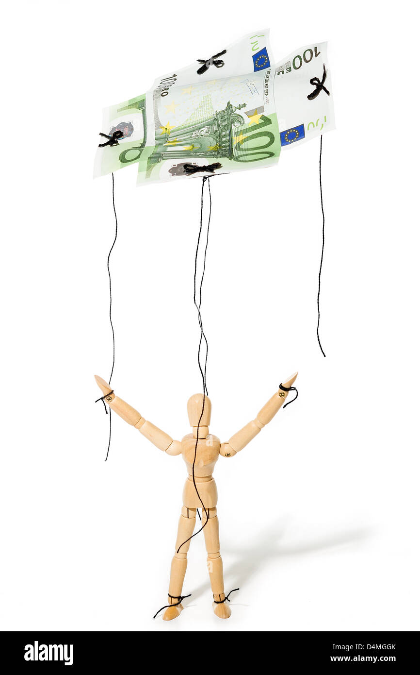 Concept, une marionnette contrôlée par l'argent, lui donnant la liberté Banque D'Images