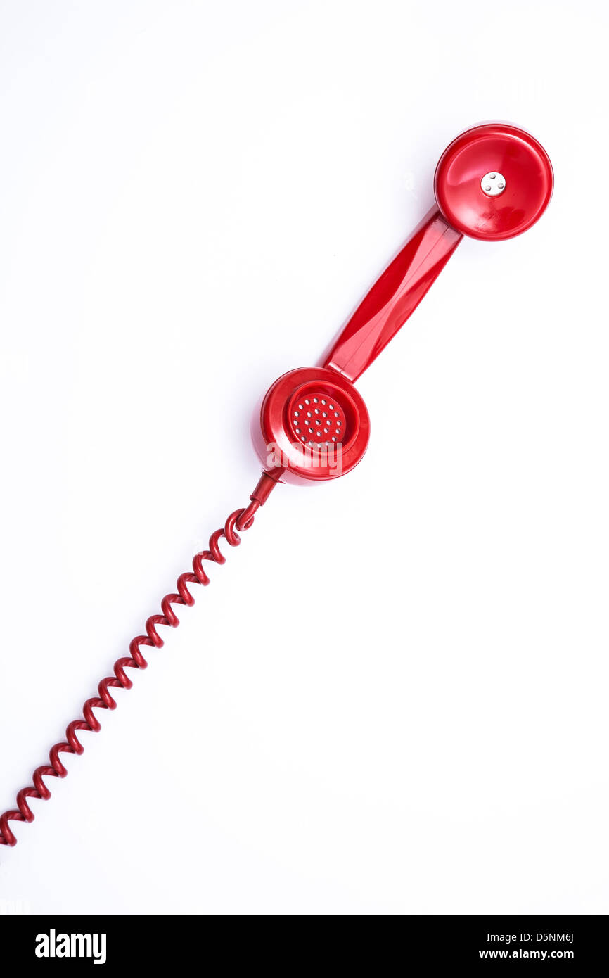 Style rétro rouge récepteur téléphonique et cordon. Banque D'Images