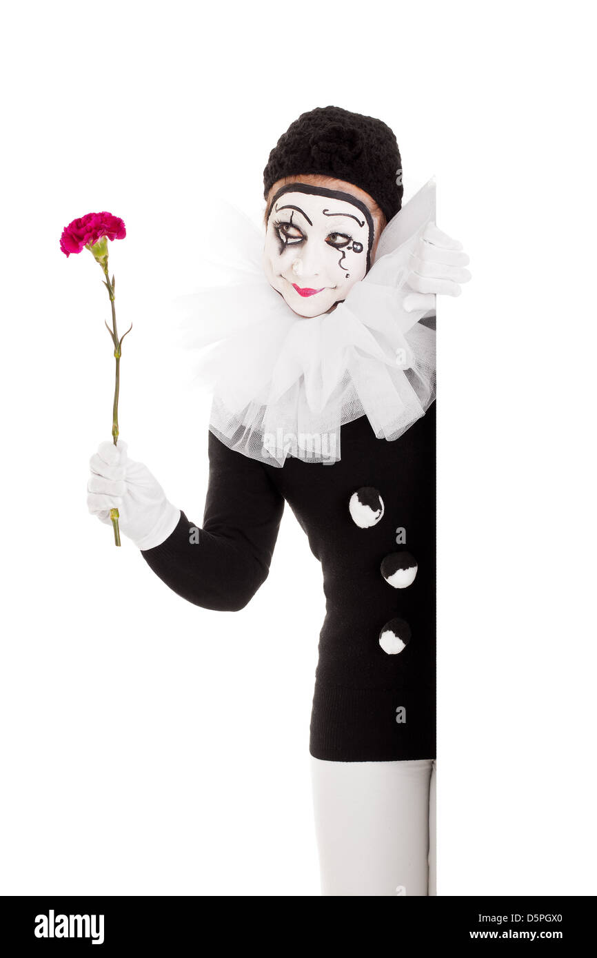 Jolie femme clown avec fleur en main Banque D'Images