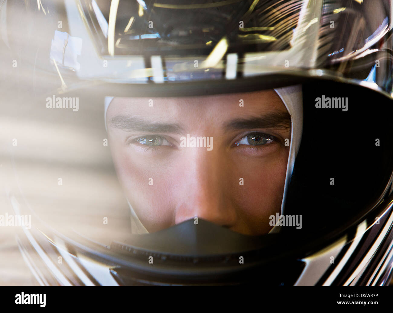 Close up of racer wearing helmet Banque D'Images