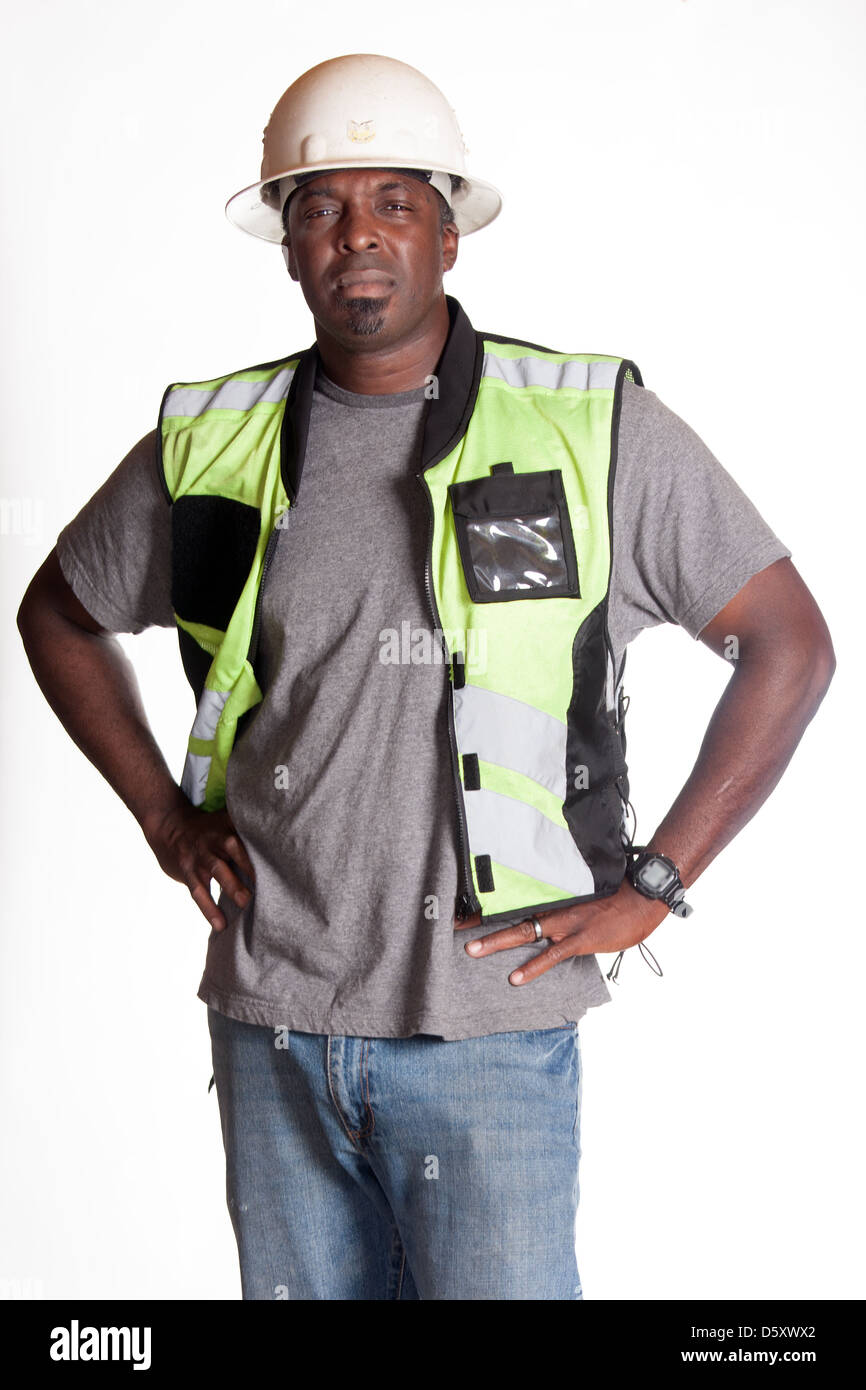 Construction Worker in hard hat avec gilet de sécurité Banque D'Images