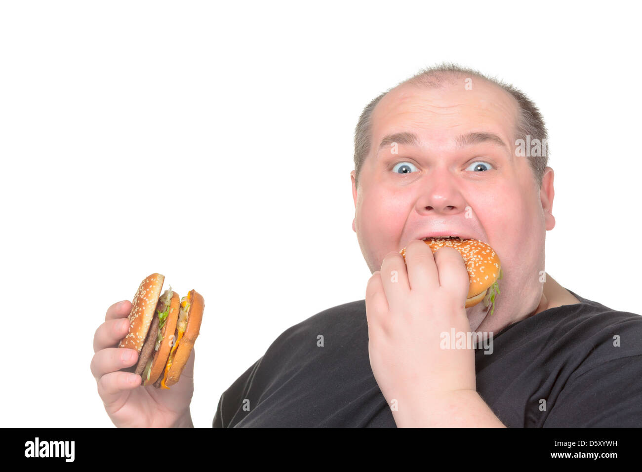 Fat Man goulument Eating Hamburger Banque D'Images