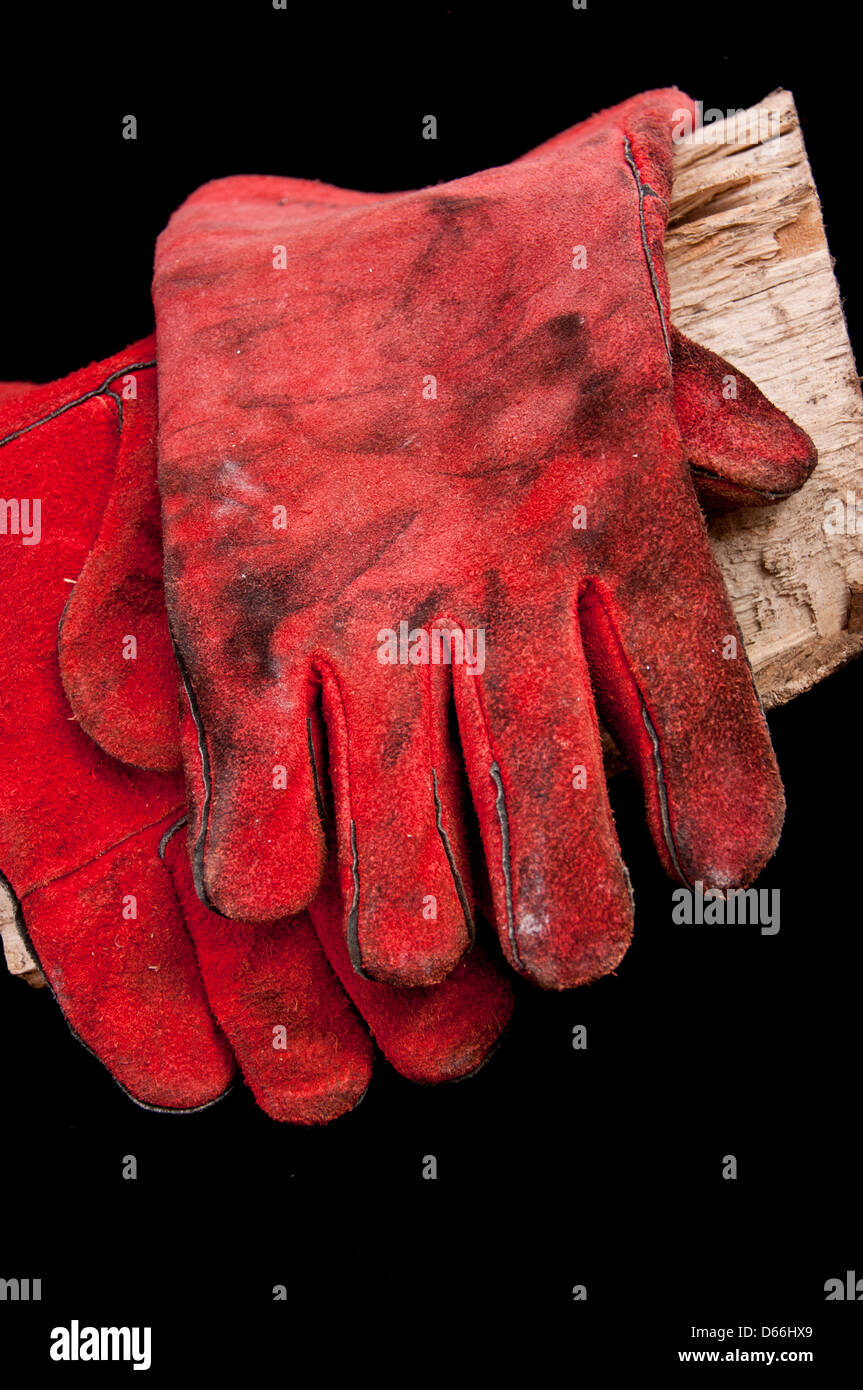 Gants en cuir pour cuisinière poêle à bois Banque D'Images