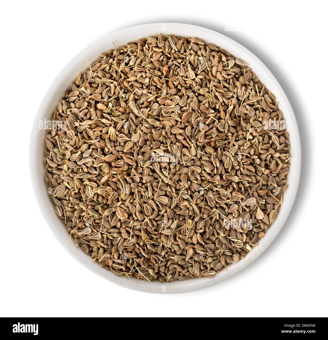 De Graines d'anis dans la plaque, isolé sur fond blanc Banque D'Images