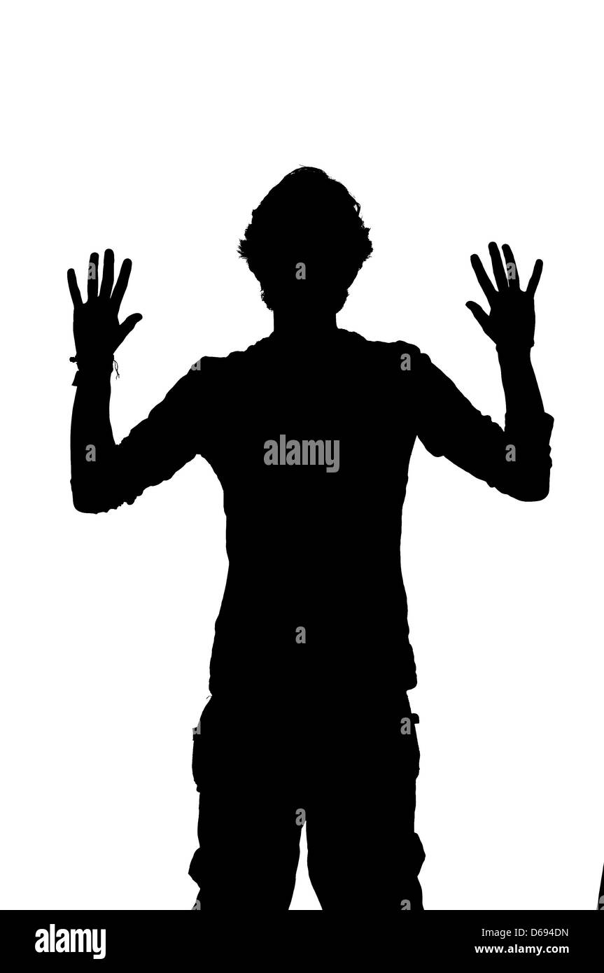 Silhouette d'un homme se faire voler avec hands up Banque D'Images