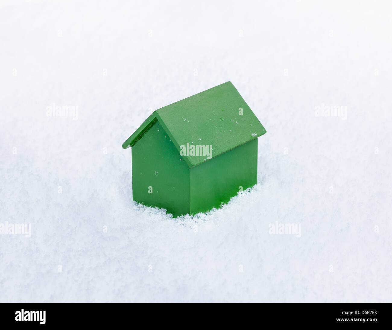 Model house sitting in snow Banque D'Images
