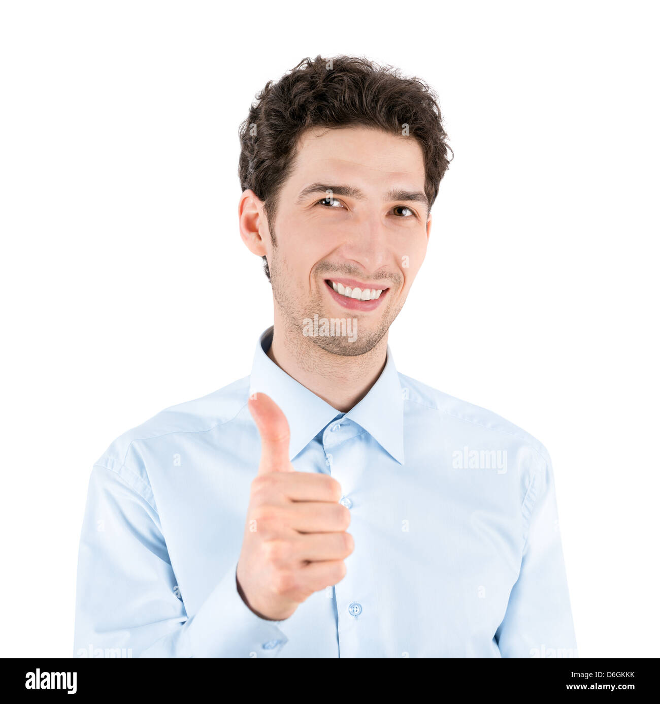 Close-up portrait of a handsome businessman réussie qui sourit et montre un geste vers le pouce à l'appareil photo. Banque D'Images