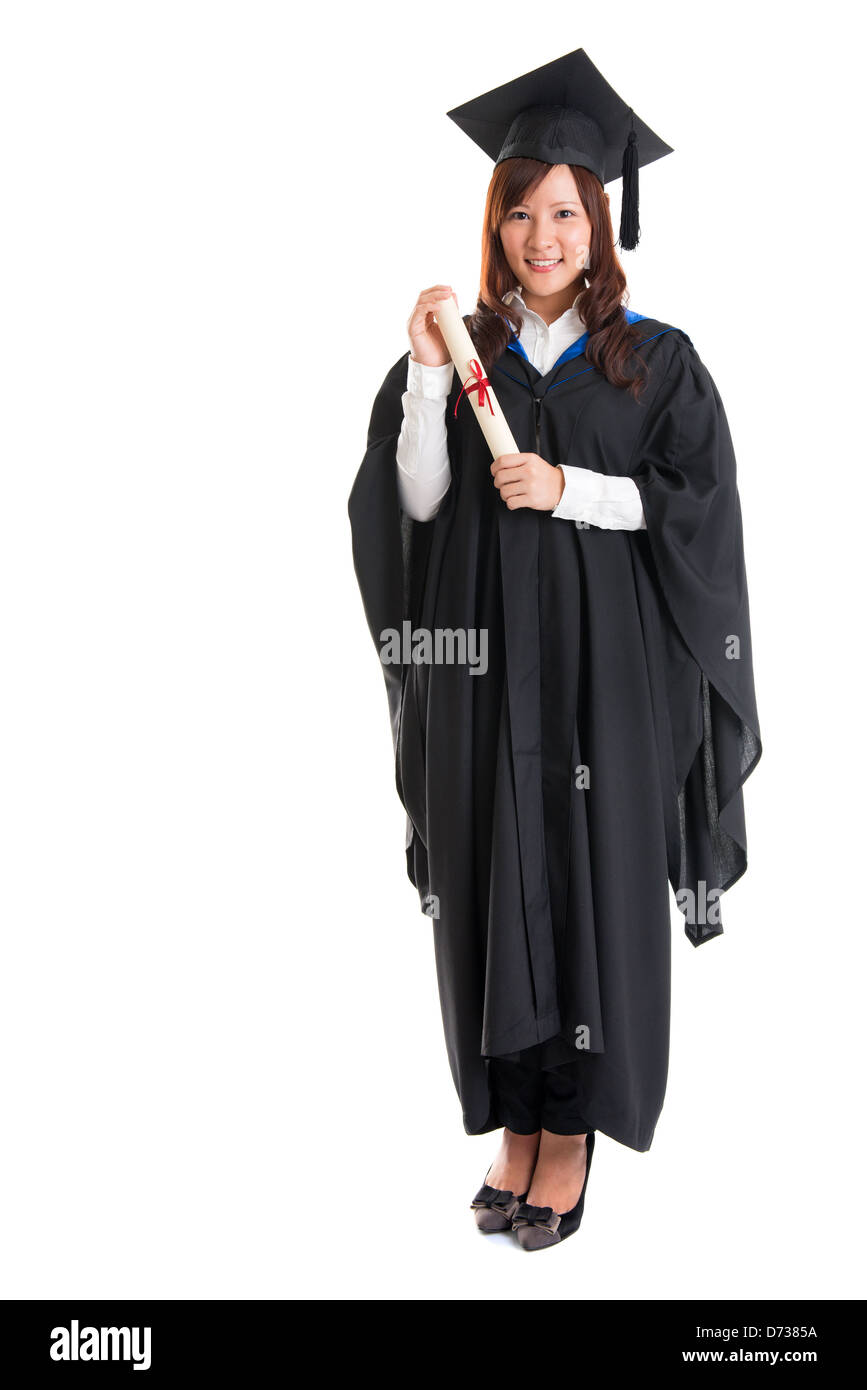 Corps plein happy Asian female student in graduation gown article isolé sur fond blanc Banque D'Images