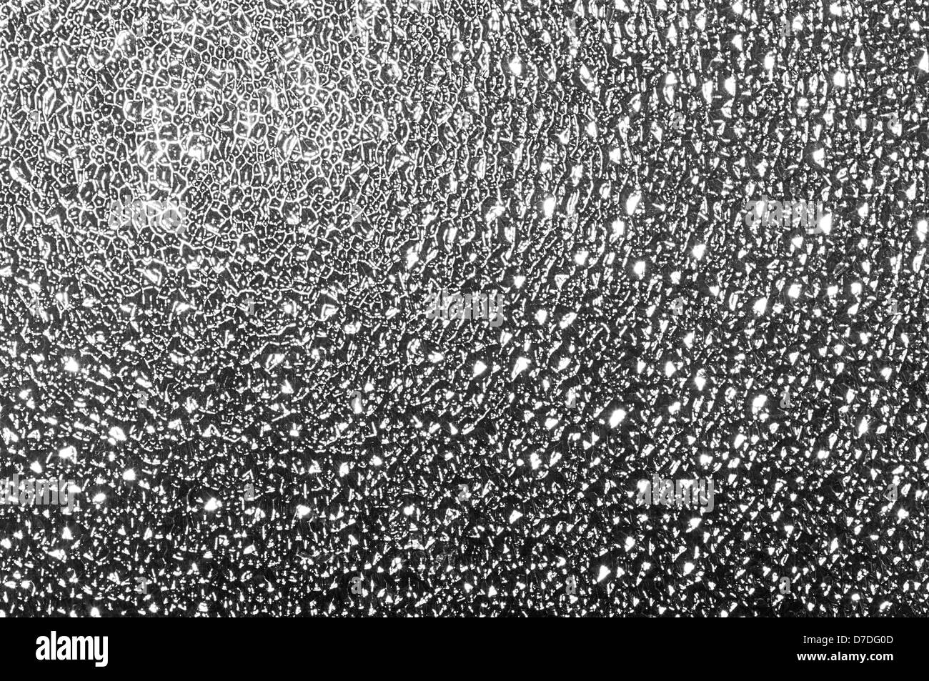 Surface rugueuse sur la vitre. Banque D'Images