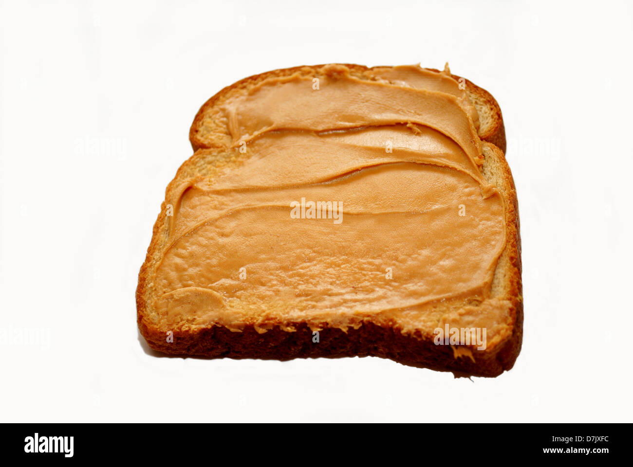 Peanutbutter sur une tranche de pain de blé Banque D'Images