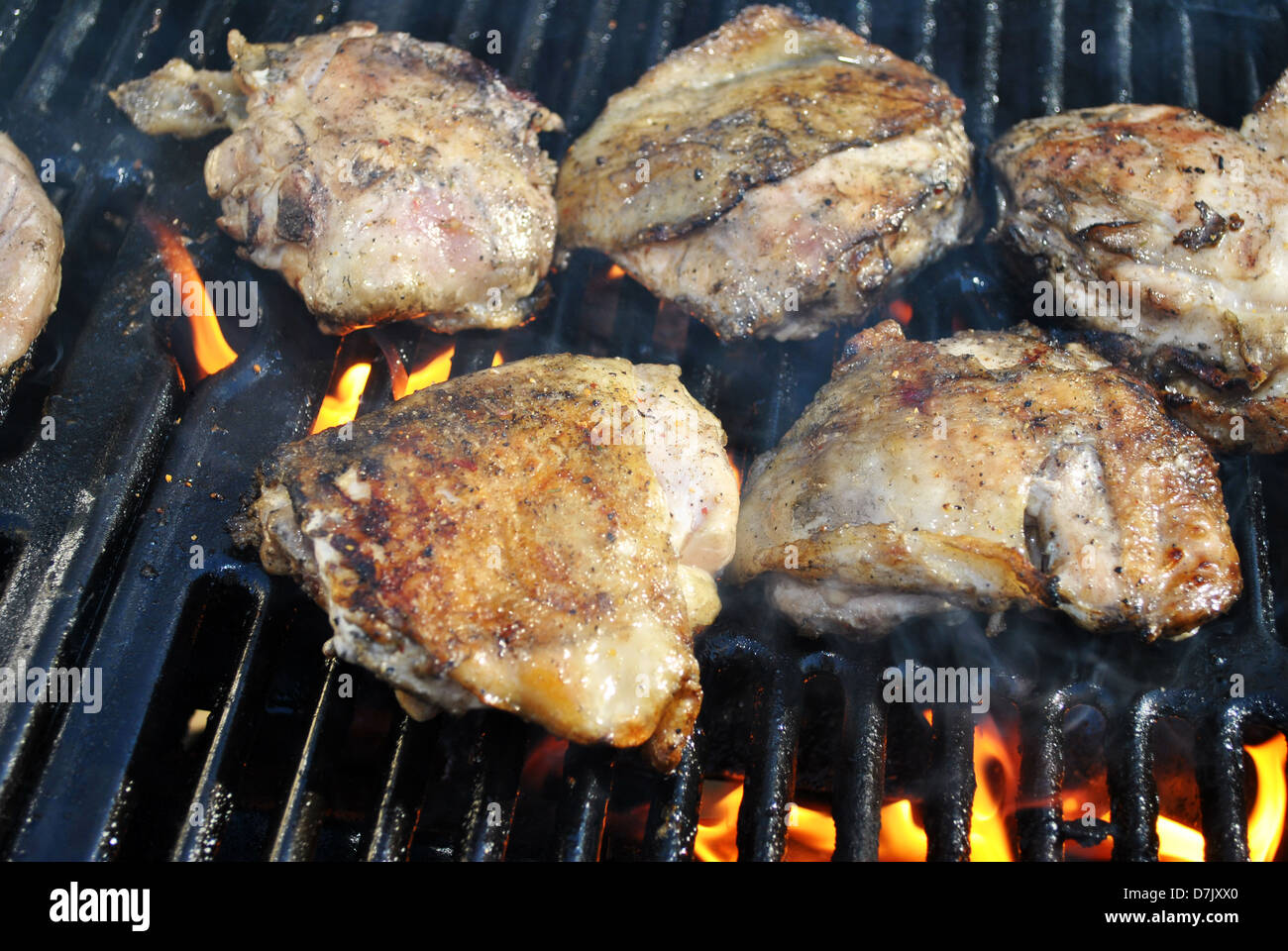 Cuisses de poulet en flammes Banque D'Images