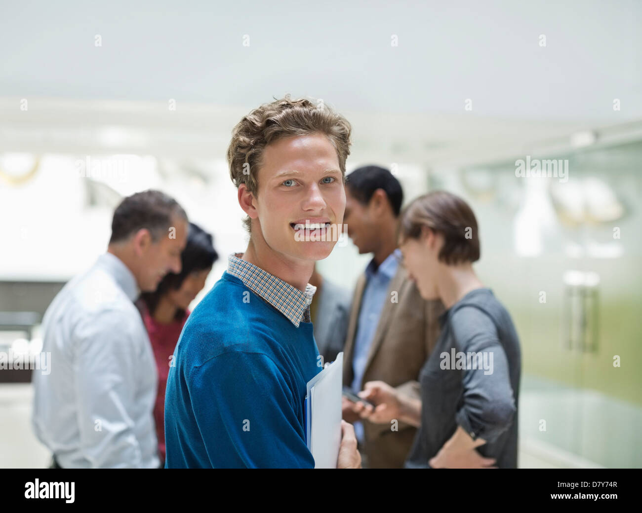 Businessman smiling in meeting Banque D'Images