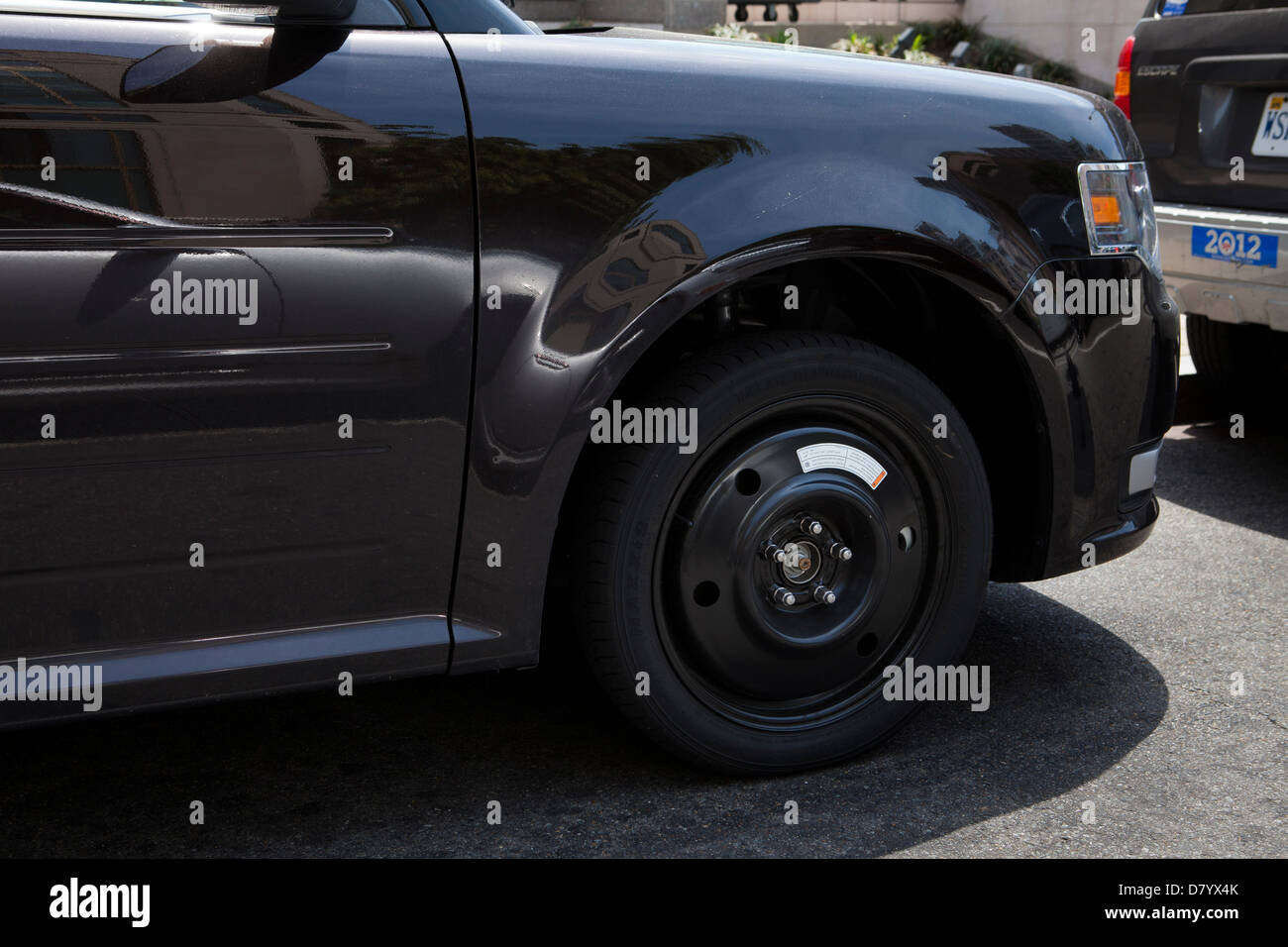 Voiture sur roue de secours Banque D'Images
