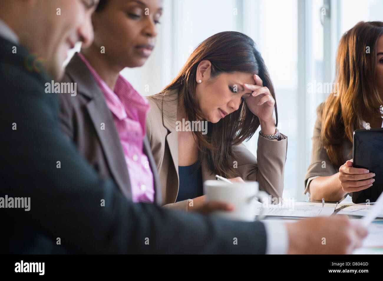 Businesswoman making notes in meeting Banque D'Images