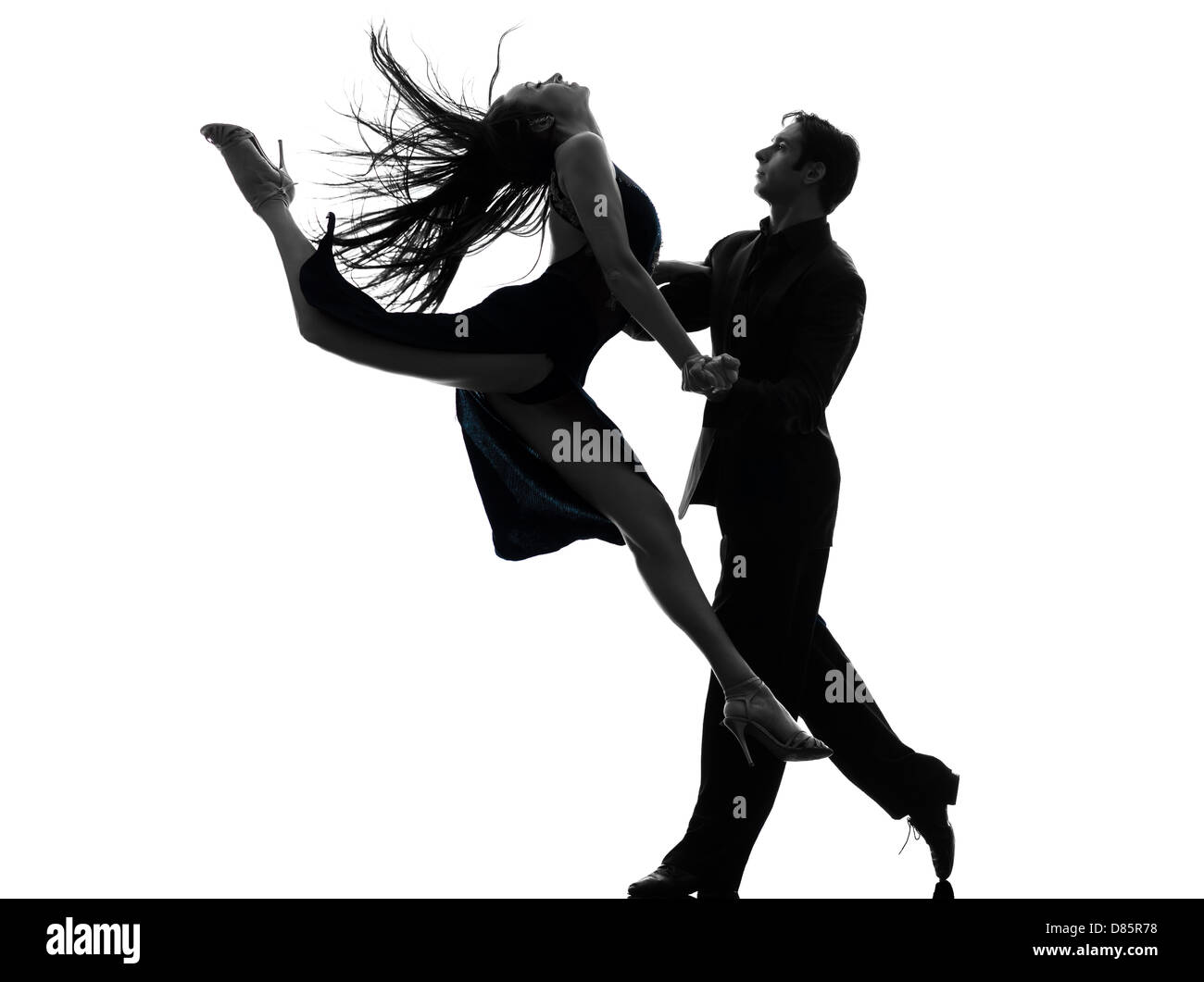Un couple homme femme ballroom dancers laughing en silhouette studio isolé sur fond blanc Banque D'Images