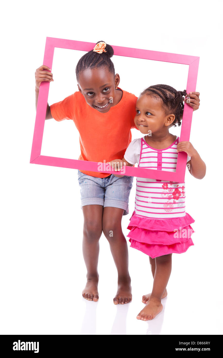 Portrait of a cute little african american girls, tenant une photo ...
