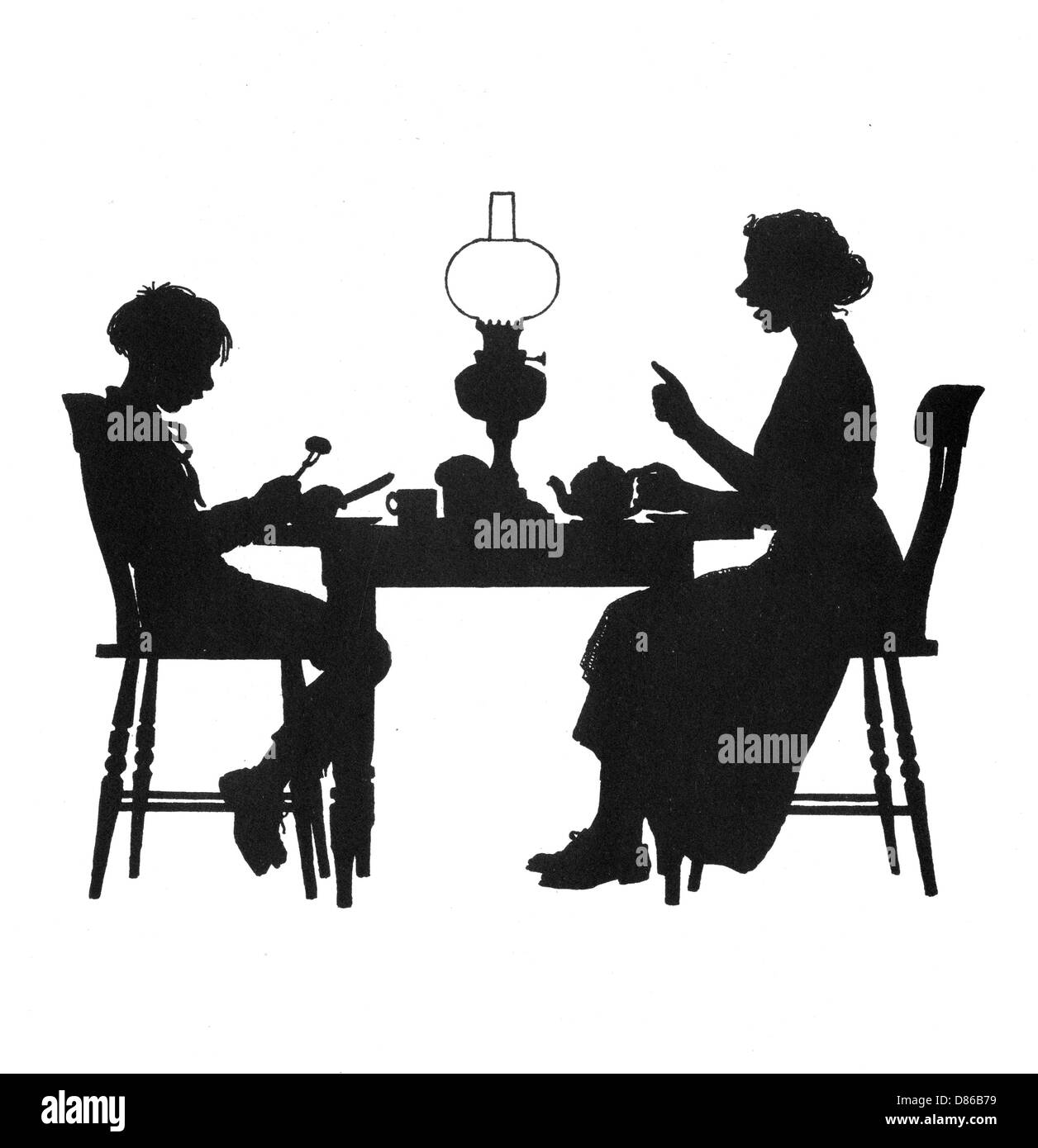 Dsoutenir et sa mère à la table du souper Banque D'Images