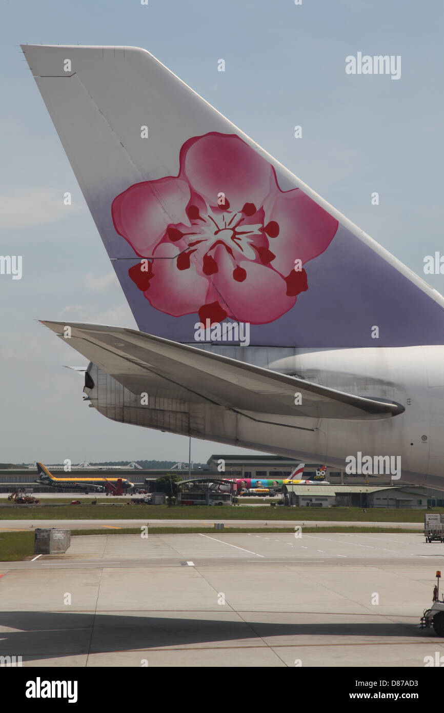 China Airlines à l'aéroport de Changi Singapour Jumbo 747 avion aéroport livrée de l'empennage empennage Banque D'Images