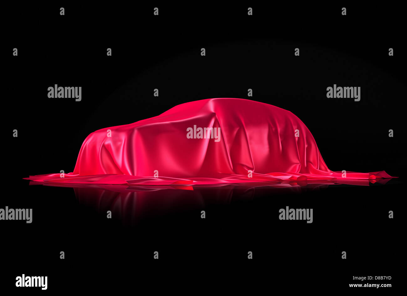 Nouvelle voiture sur un banc sous le tissu rouge présentation concept isolé sur fond noir Banque D'Images