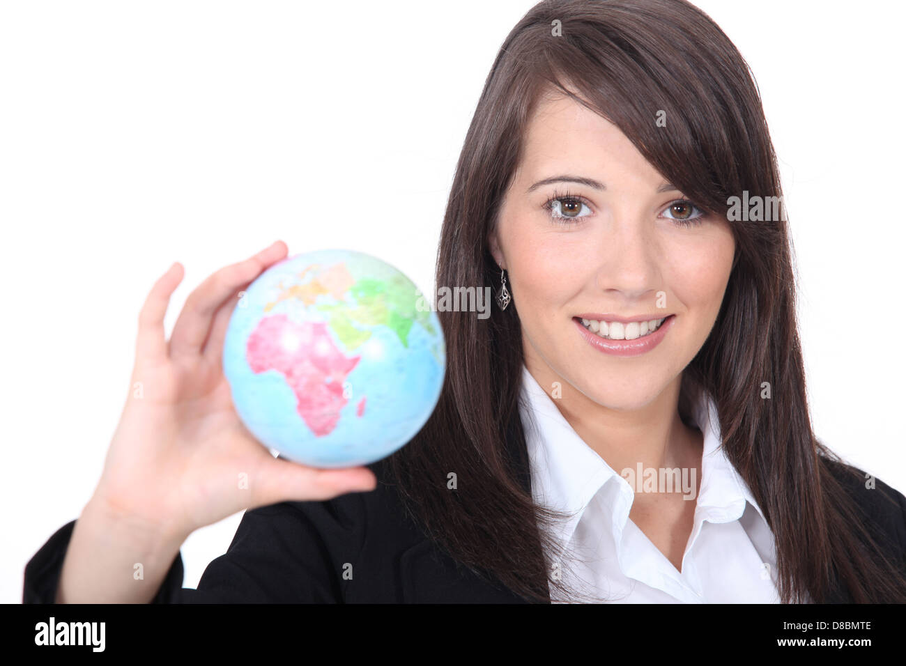 Woman holding out world globe Banque D'Images