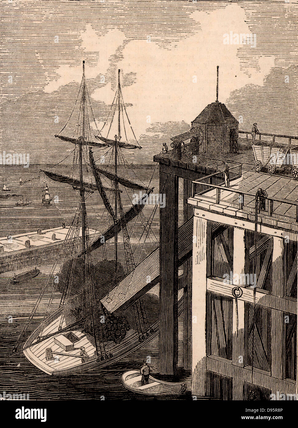 Seaham Harbour, comté de Durham, Angleterre. Chargement d'un navire à voile avec le charbon. Les wagons ont été déchargées dans le haut de la "pout' sur l'staithe ou quai. La partie inférieure du bec a été positionné sur la cale du navire. Seaham Harbour et la nouvelle ville a été fondée en 1828 à exporter du charbon de l'est de la région de Durham. Gravure tirée de "le Penny Magazine' (Londres, avril 1835). Banque D'Images