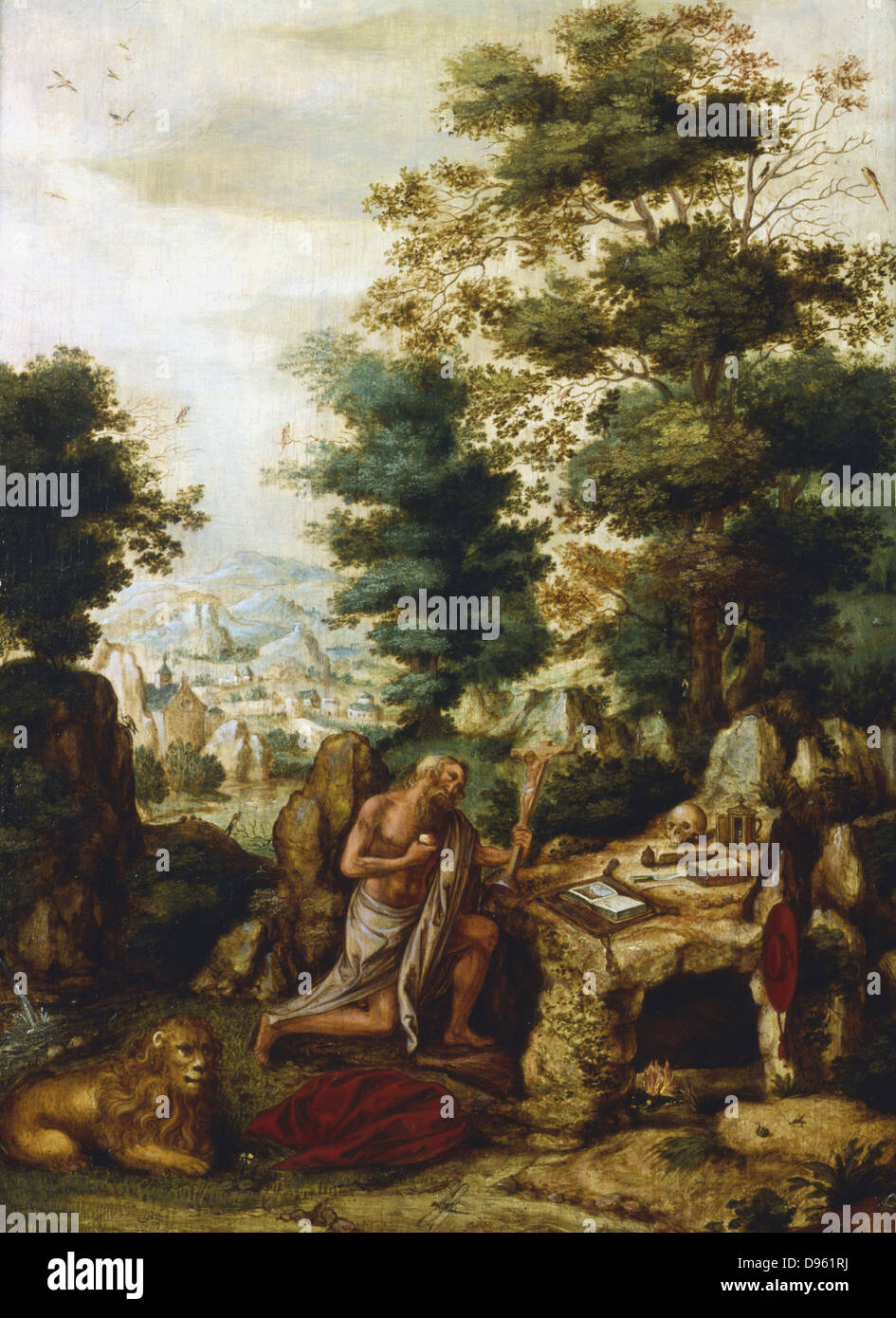 'St Jerome dans un paysage'. Saint Jérôme (340-420) né à Strido, Dalmatie (Croatie) a été l'un des quatre grands docteurs de l'église chrétienne. Il s'agenouille devant la Croix, son compagnon lion au premier plan et son chapeau de cardinal pendaison le ourtside rock sa cellule. Henri met de Bles (c1510-1550) artiste flamand. Huile sur bois. Collection privée. Banque D'Images