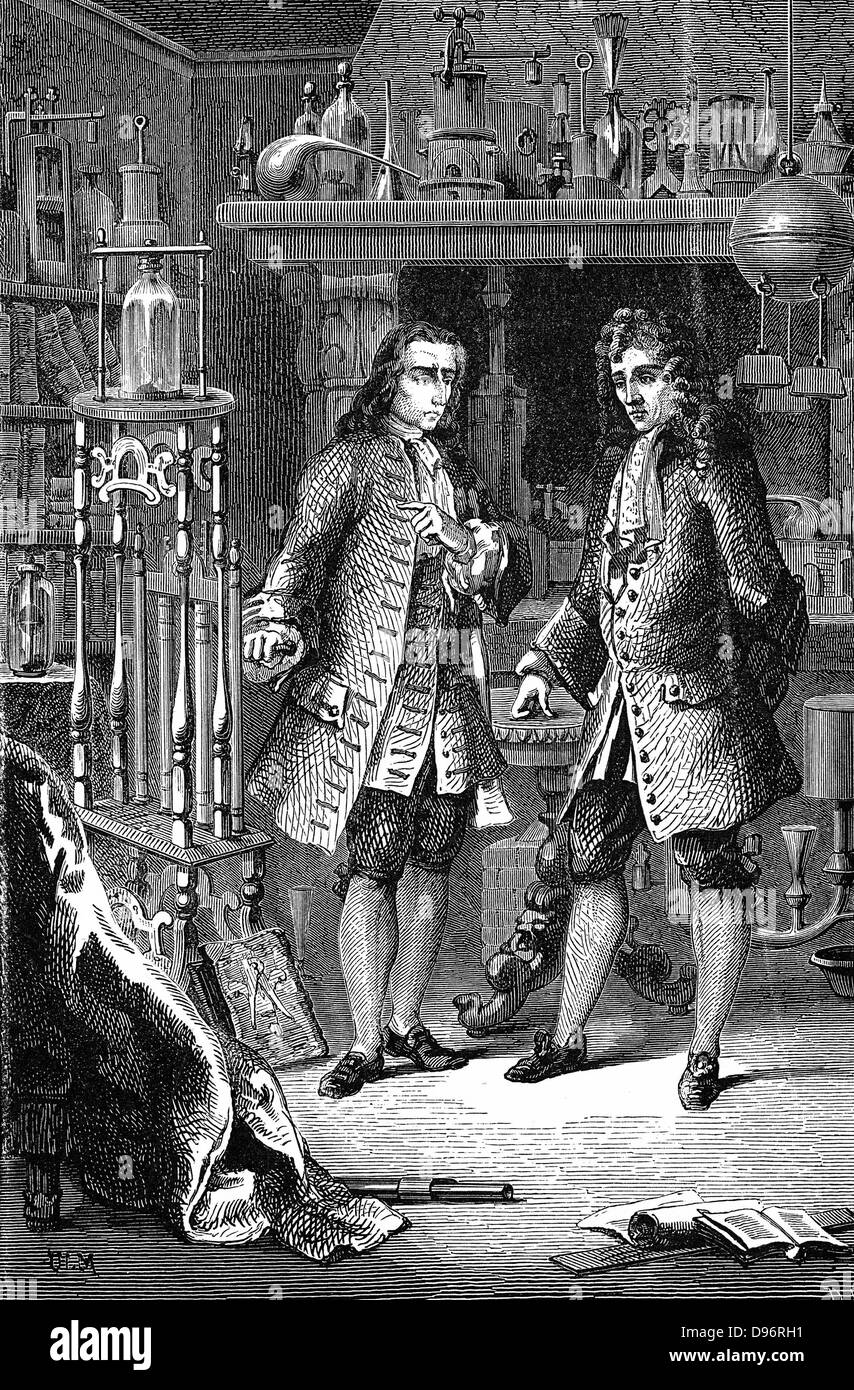 Robert Boyle (1627-1691) chimiste et physicien anglo-irlandais, dans son laboratoire avec Denis Papin (1647-1712) Physicien français. Papin pointe vers la pompe à air de Boyle. Illustre probablement discussion entre Boyle et Papin sur l'utilisation de la pression atmosphérique pour élever l'eau. La gravure sur bois, Paris 1870. Banque D'Images