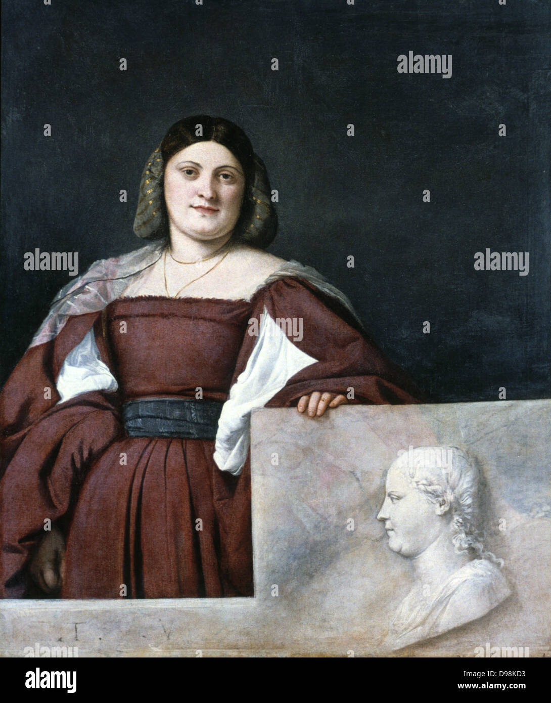 Portrait d'une femme 'La Schiavona" (femme de la dalmatie) c1510-1512. Huile sur toile. Woman with hand on parapet sur lequel est sculpté le buste de profil. Tiziano Vecellio (Titien appelé c1488/1490 591-1576) peintre de l'école vénitienne. Banque D'Images