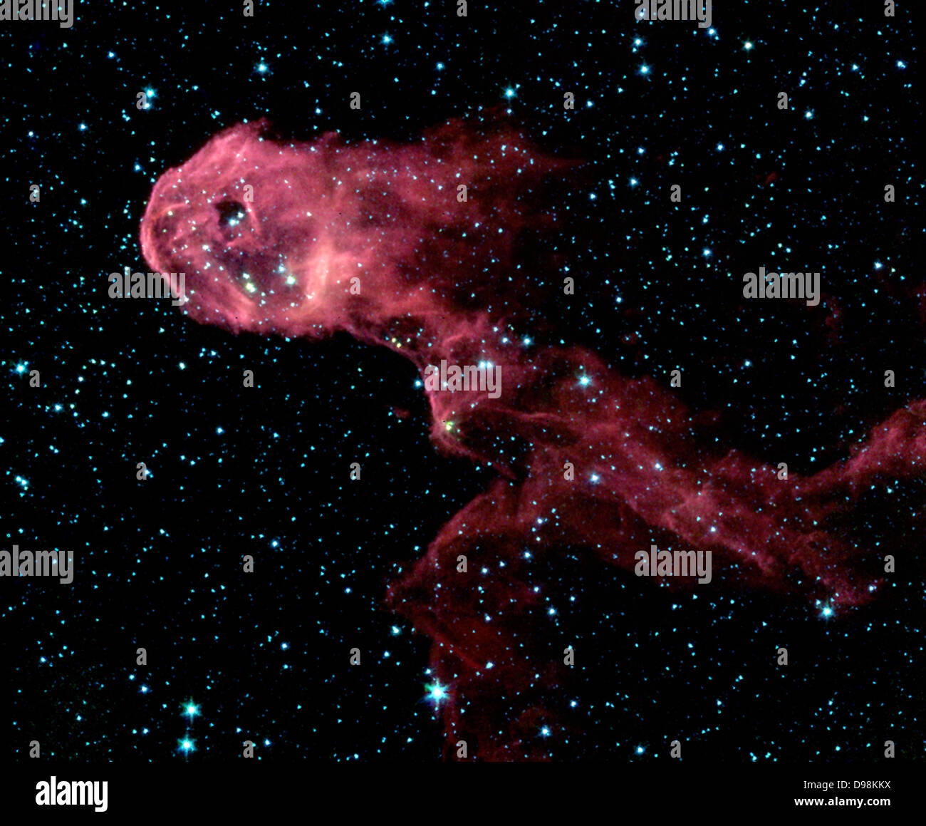 Au télescope spatial Spitzer de la NASA image d'une pépinière stellaire lumineux offre un contraste spectaculaire à la vue dans les nuages opaques Banque D'Images