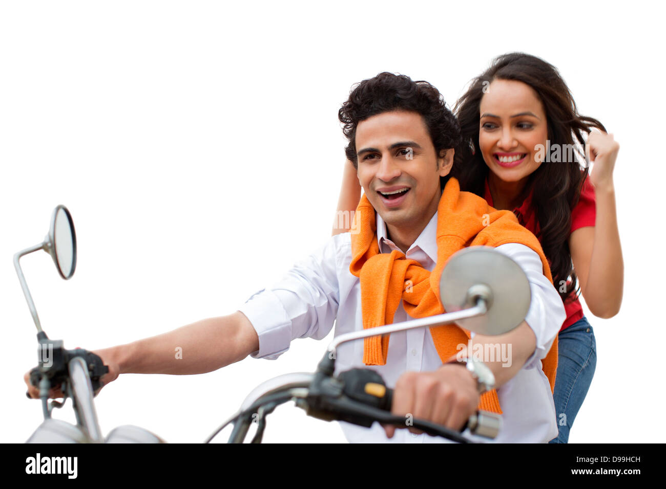 Couple riding a motorcycle and smiling Banque D'Images