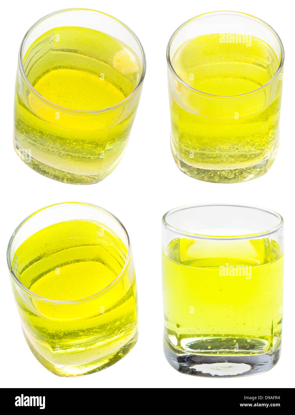 Verre d'eau gazeuse jaune avec vitamine C isolé sur fond blanc Banque D'Images