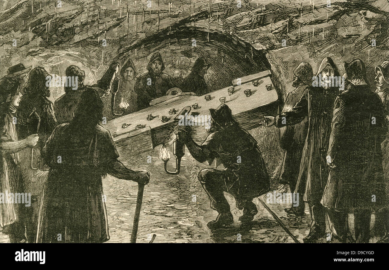 Briser la dernière partition et les hommes des deux extrémités du fonctionnement réunion dans le tunnel ferroviaire sous la Mersey Liverpool et doublure de Birkenhead. Gravure, 1884. Banque D'Images