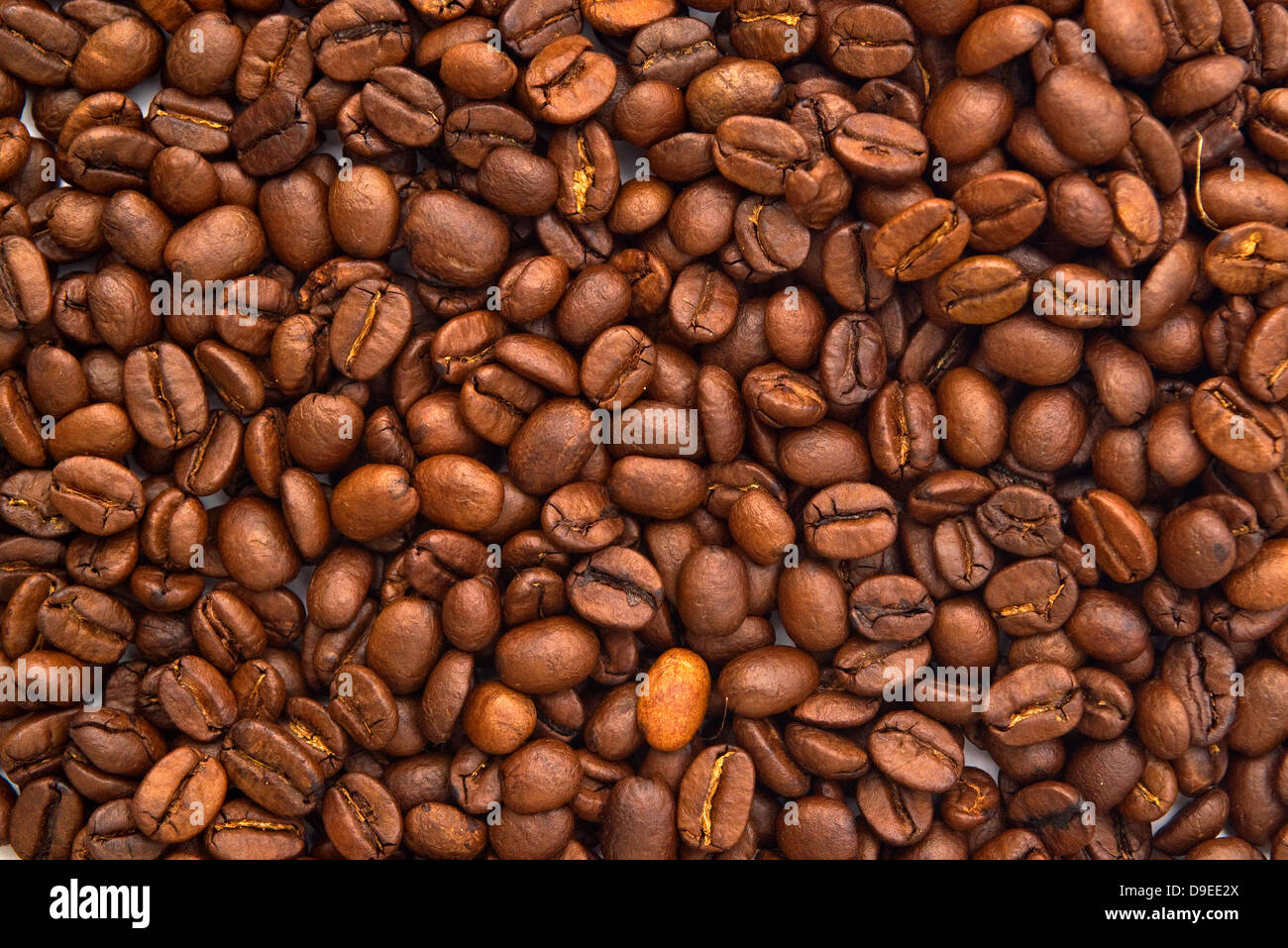 Les grains de café. Les grains de café torréfiés comme arrière-plan. Banque D'Images
