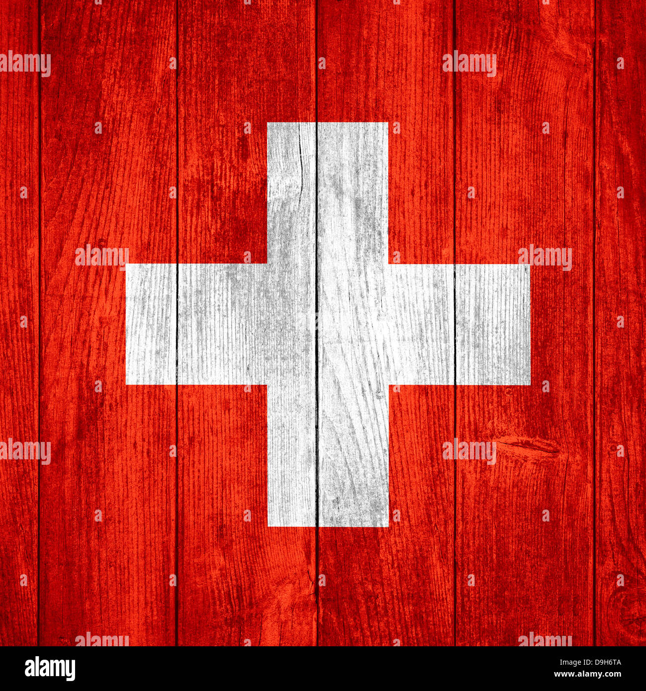 Drapeau de la Suisse ou de la bannière Suisse rouge et blanc sur fond de bois Banque D'Images