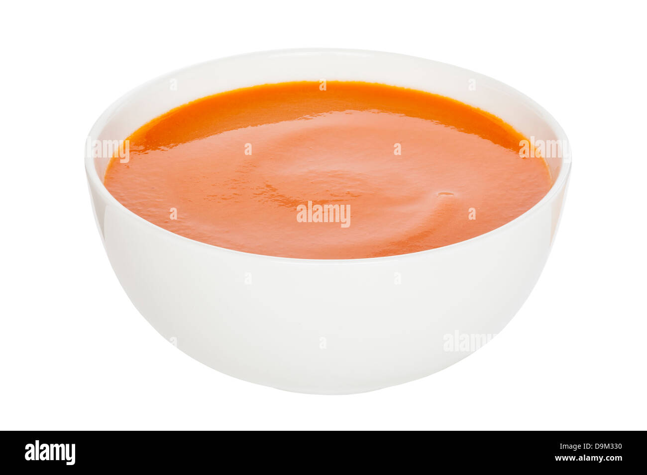 Soupe de tomate - Crème de soupe de tomate dans un bol blanc de Chine, chemin, l'avant à l'arrière. Banque D'Images