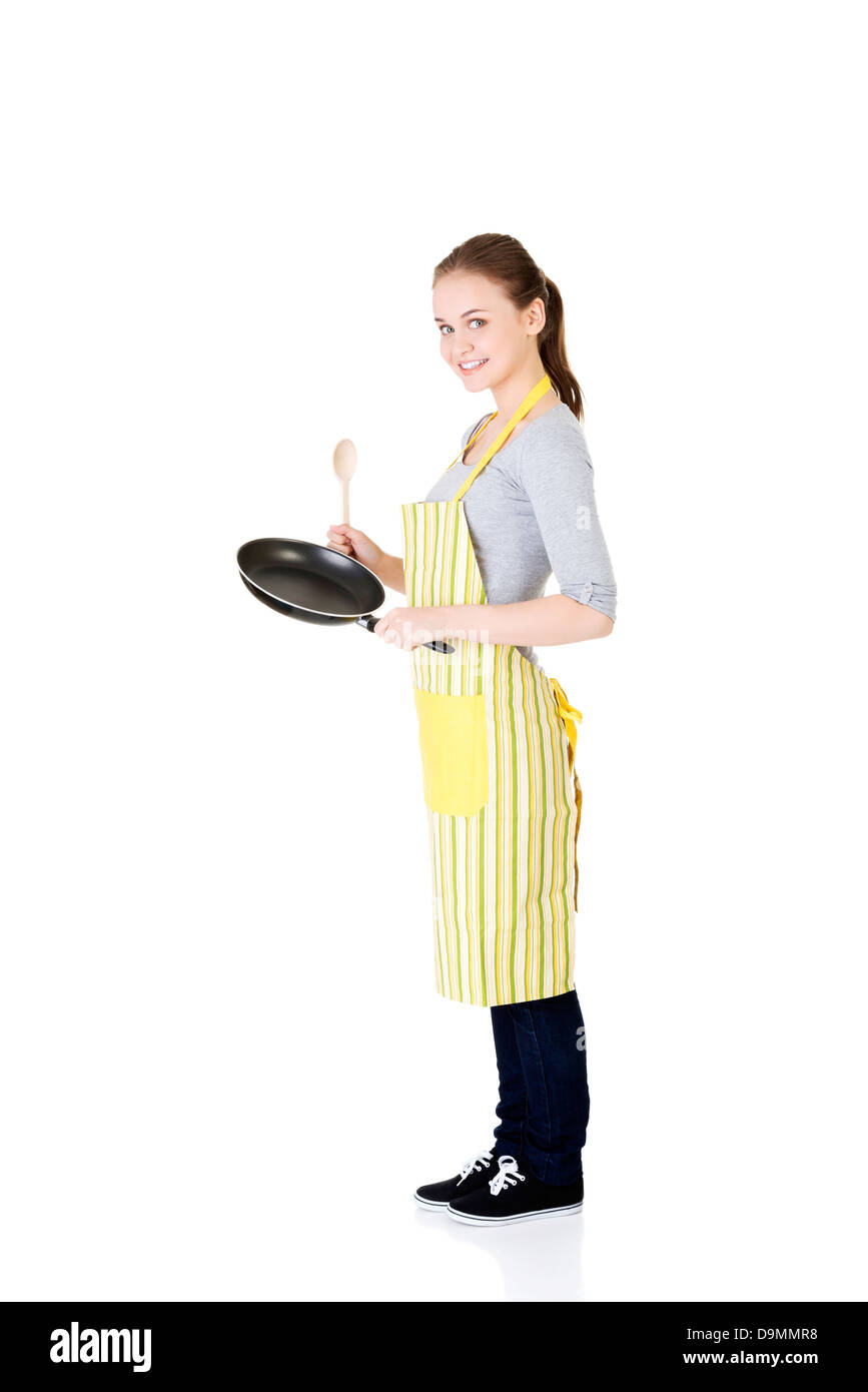 Jeune femme la cuisson des aliments sains, isolé sur blanc. Banque D'Images