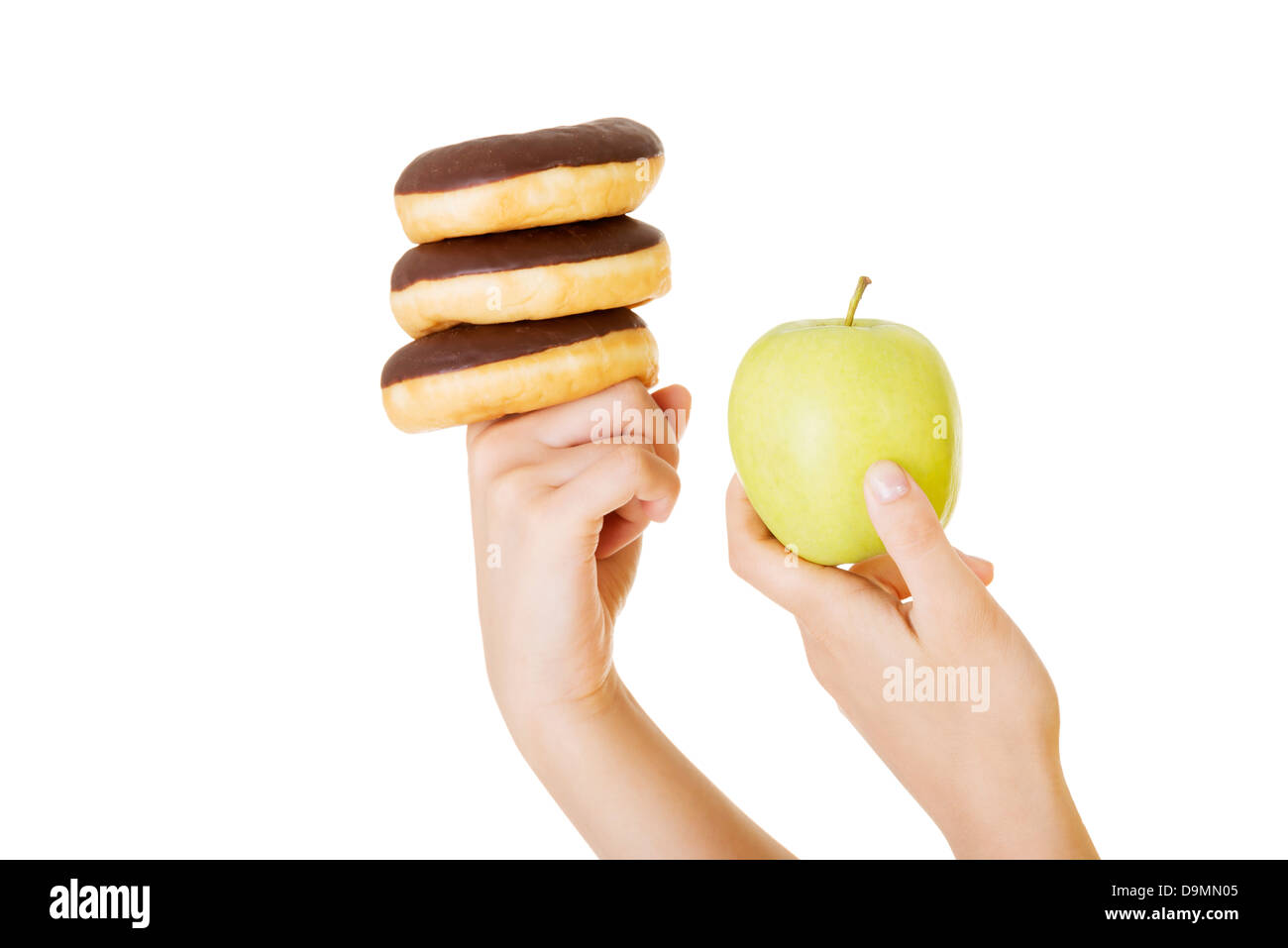 Donut ou pomme verte - choix difficile. Concept de régime. Banque D'Images