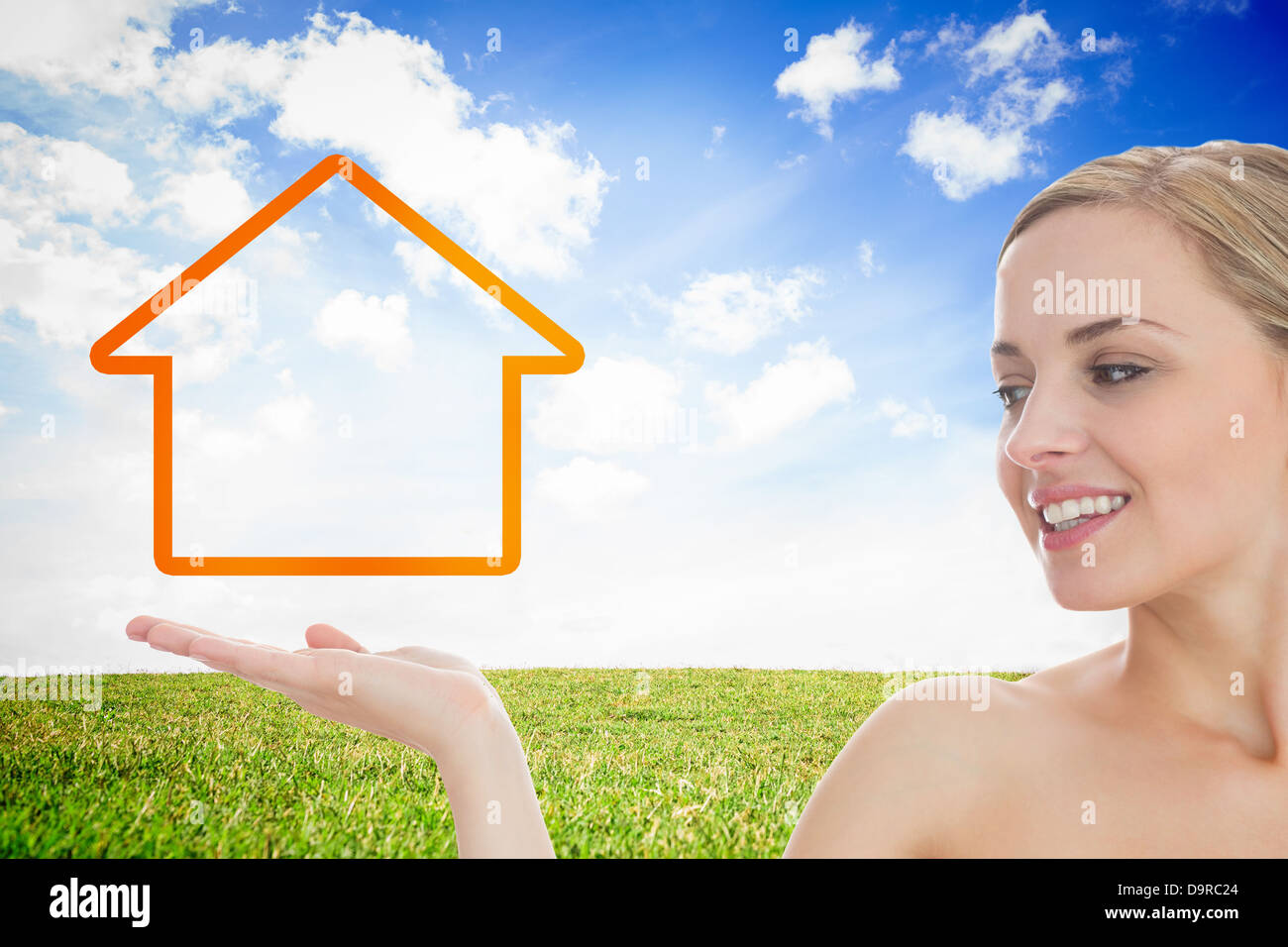 Smiling woman looking at house contours Banque D'Images Smiling woman looking at house contours Banque D'Images