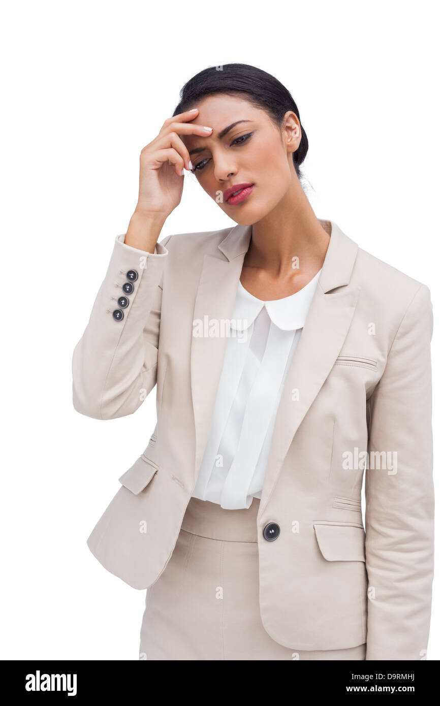 Inquiets young businesswoman holding her head Banque D'Images
