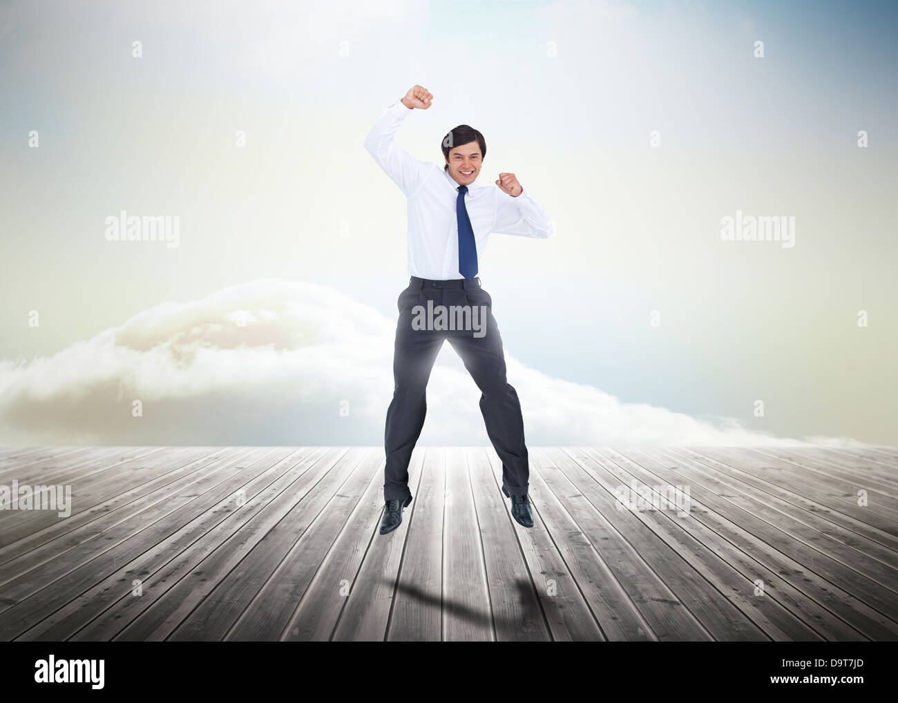 Businessman jumping sur des planches Banque D'Images