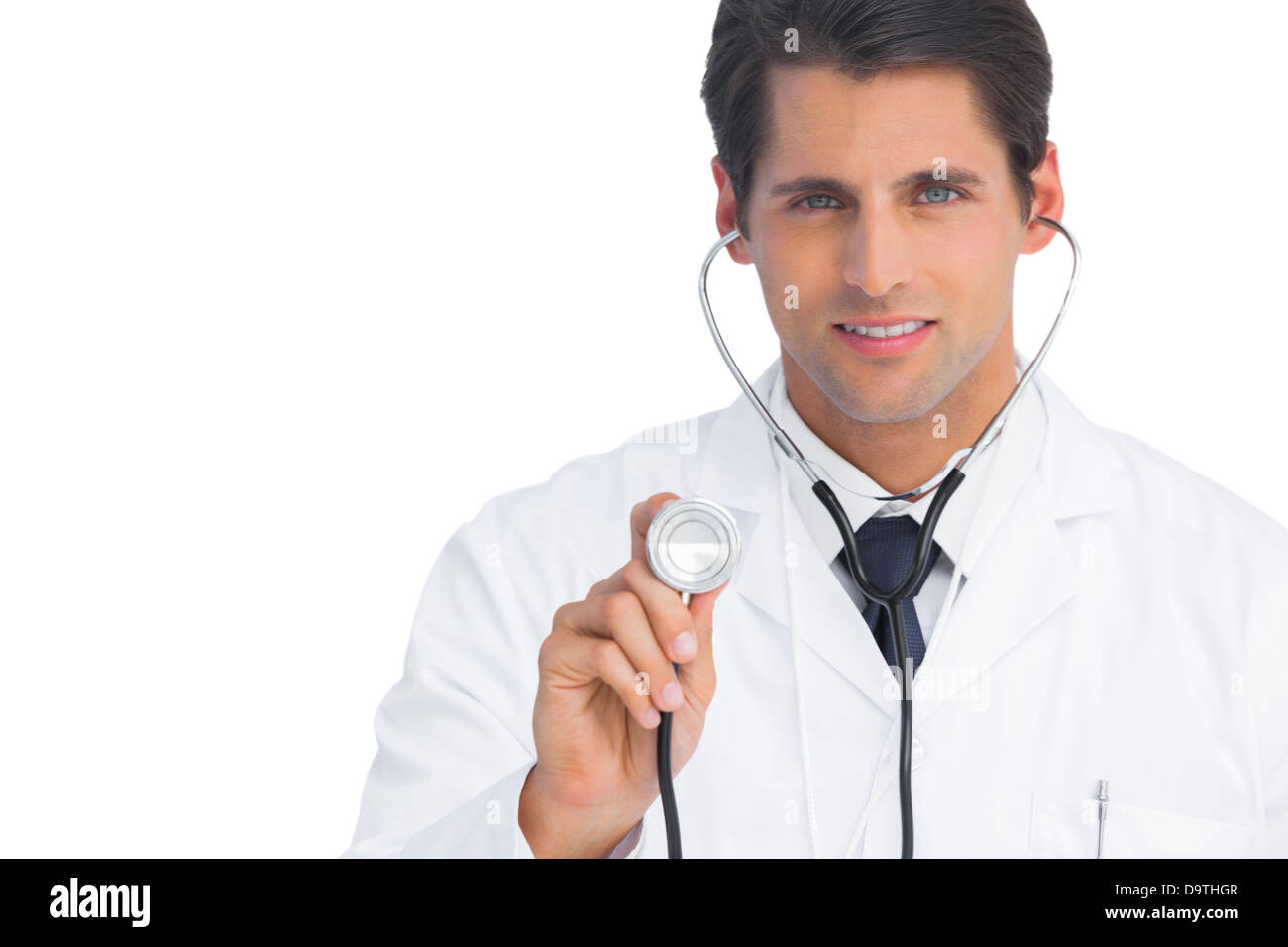 Doctor holding up stethoscope Banque D'Images