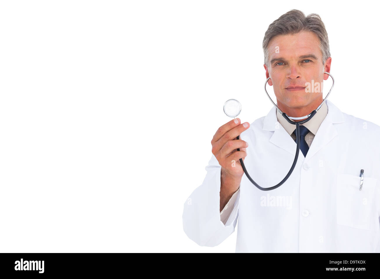 Serious doctor holding stethoscope Banque D'Images