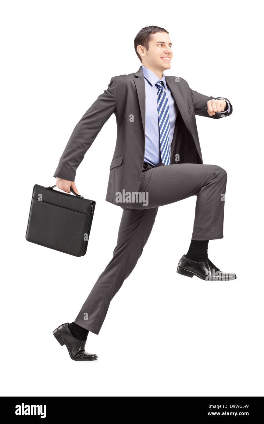 Portrait d'un homme de faire un énorme pas vers Banque D'Images