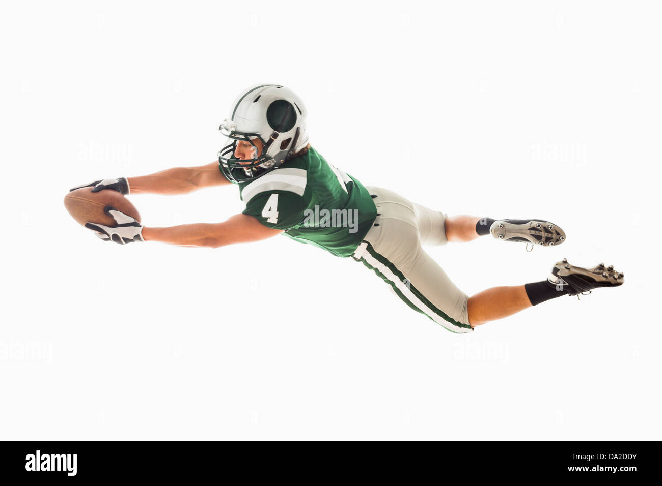 Portrait of American football player catching ball Banque D'Images
