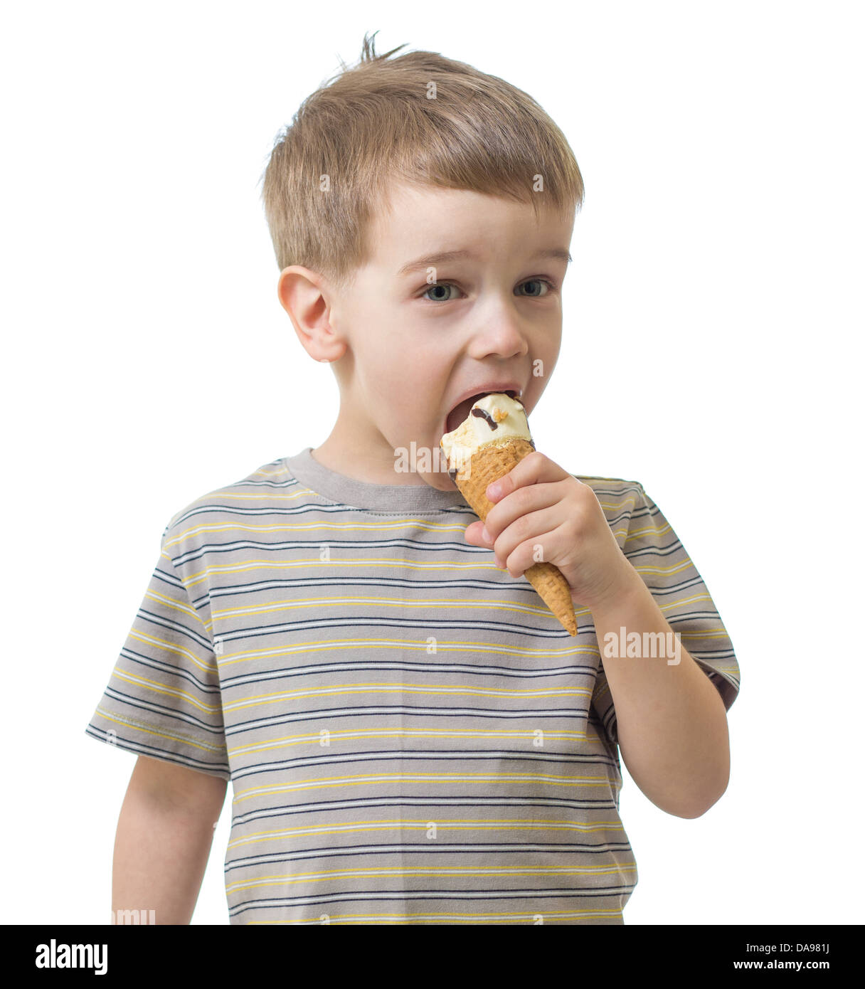 Kid boy eating ice cream isolated on white studio shot Banque D'Images