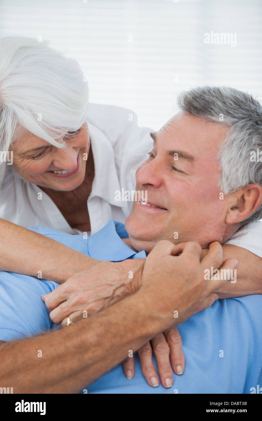 White haired woman hugging mari Banque D'Images