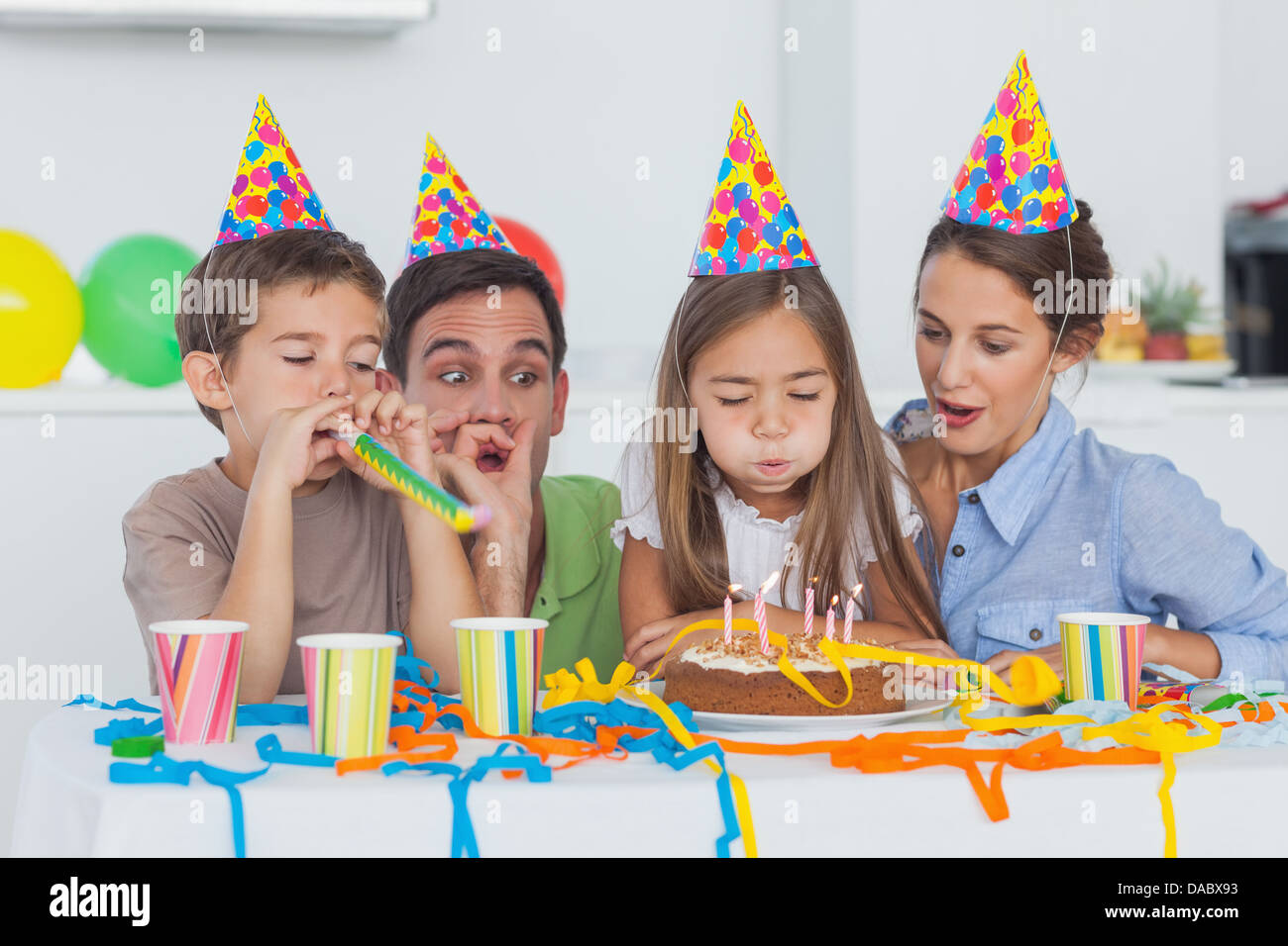 Little girl blowing her candles during her Birthday party Banque D'Images