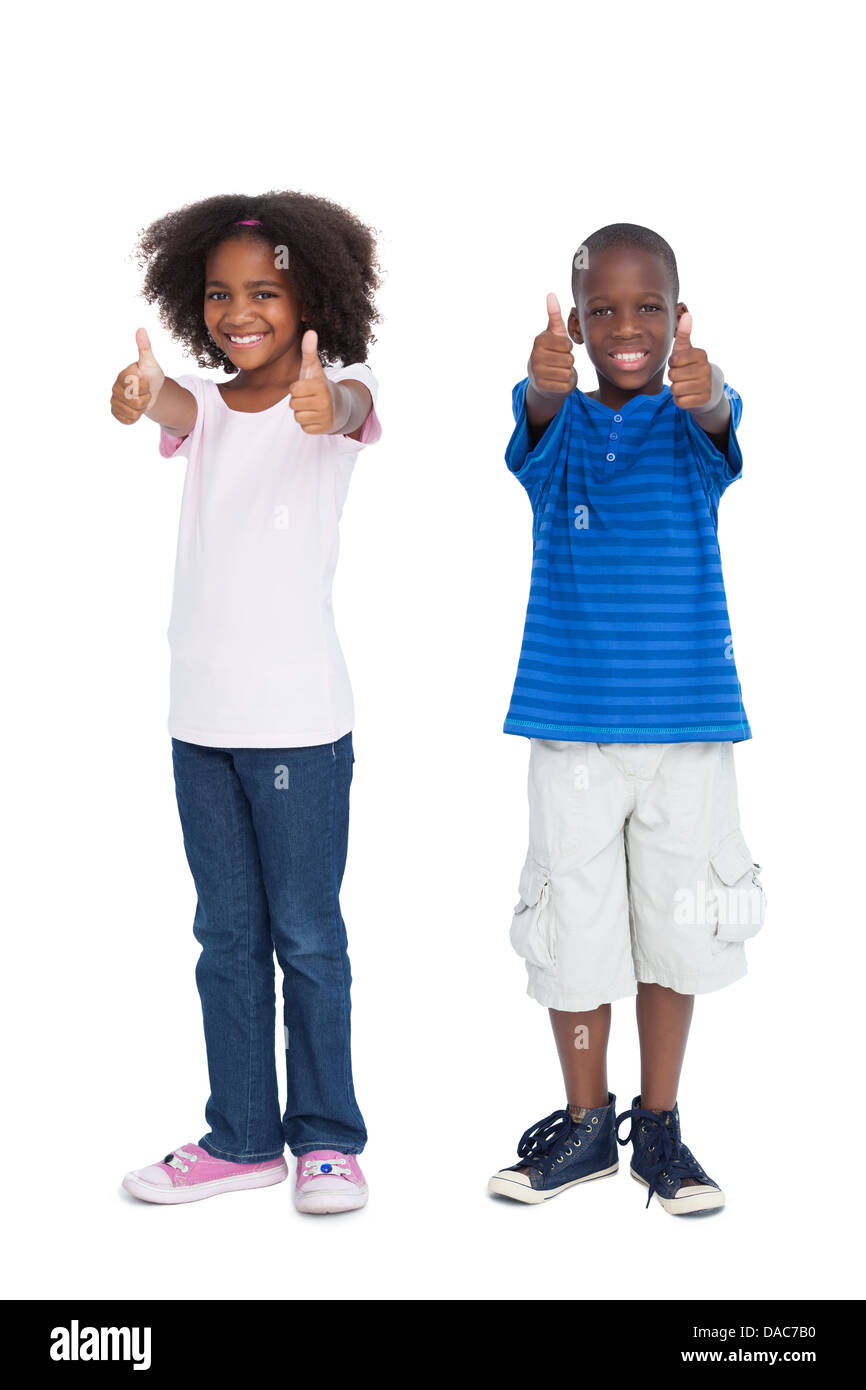 Frère et soeur avec Thumbs up Banque D'Images
