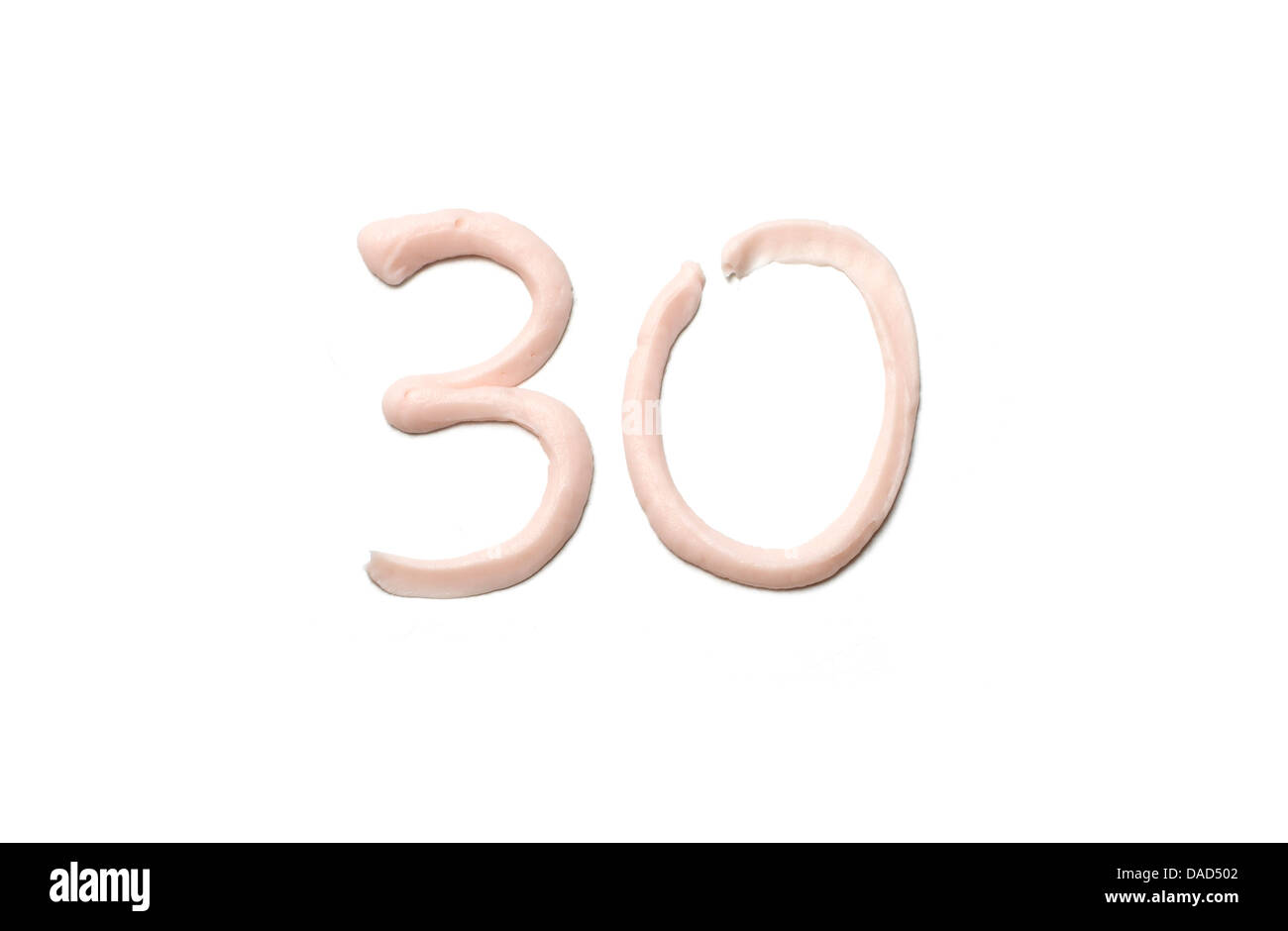 Beige crème corps rose numéro 30 couper sur un fond blanc Banque D'Images