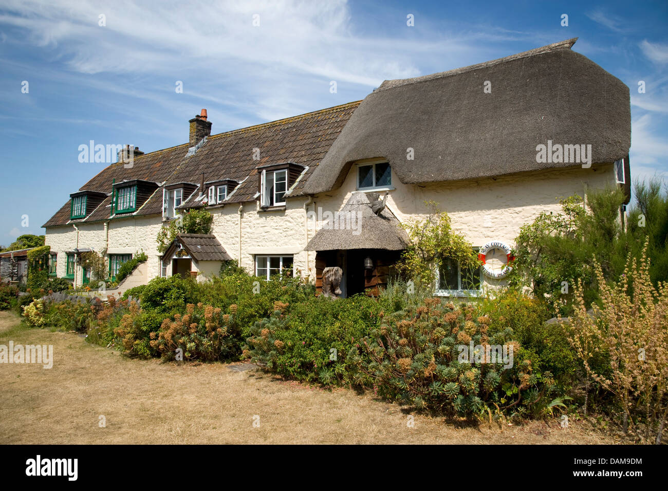 Chalets côte à Porlock Weir, Somerset, Angleterre. Banque D'Images